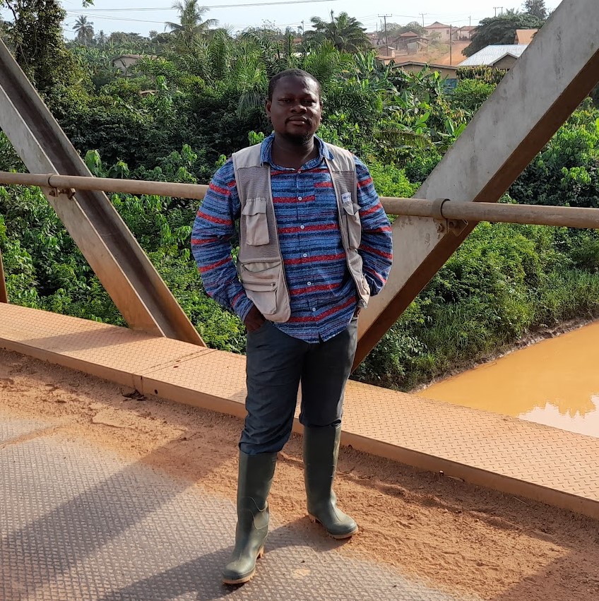 Man standing on a bridge