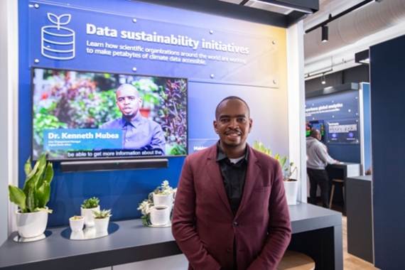 A person standing in front of a screen
AI-generated content may be incorrect.